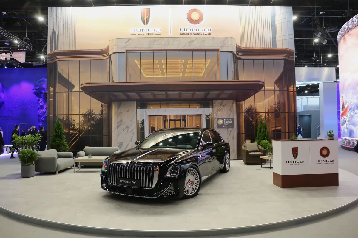 The HONGQI stand at SPIEF: the Guoya in front of the printed backdrop of a building entrance